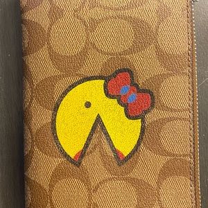 Coach ms. pacman wristlet